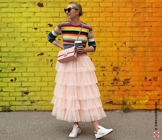 Model wearing tulle tier skirt & colourful stripe shirt