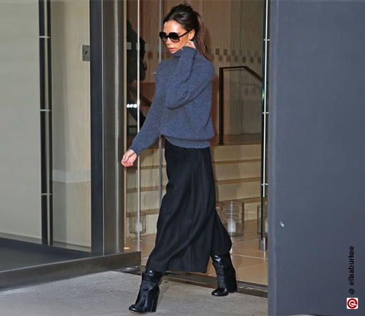 Victoria Beckham wearing a skirt with a sweater