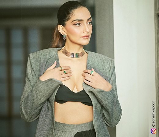 Sonam Kapoor wearing a blazer with traditional jewellery 