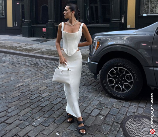 A white corset top and midi skirt