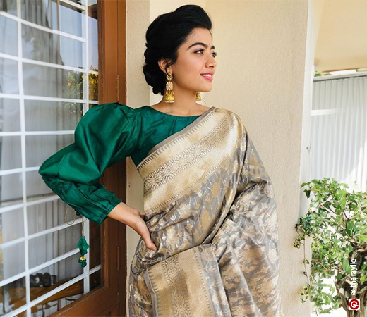 Rashmika Mandana wearing a Kanjivaram saree with a contrast blouse
