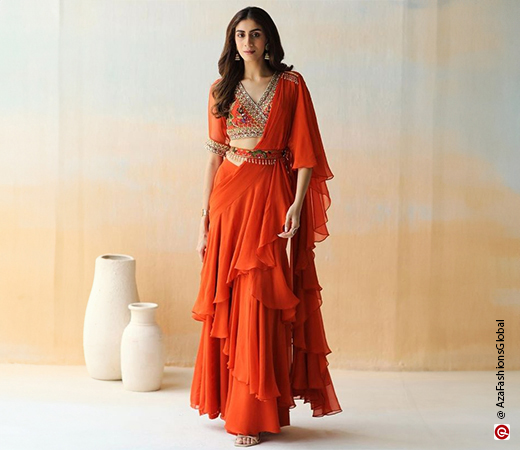 woman wearing an orange saree